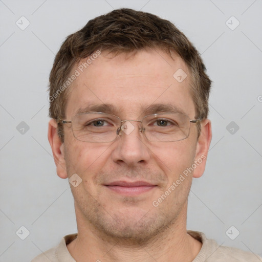 Joyful white adult male with short  brown hair and brown eyes