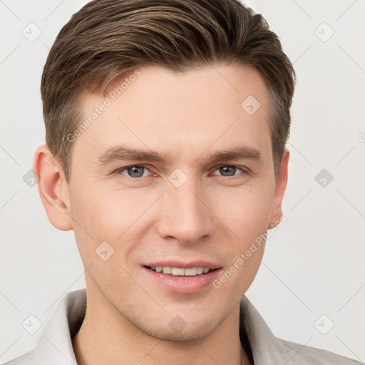 Joyful white young-adult male with short  brown hair and grey eyes