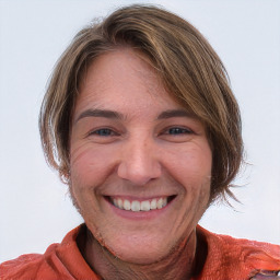 Joyful white young-adult female with medium  brown hair and blue eyes