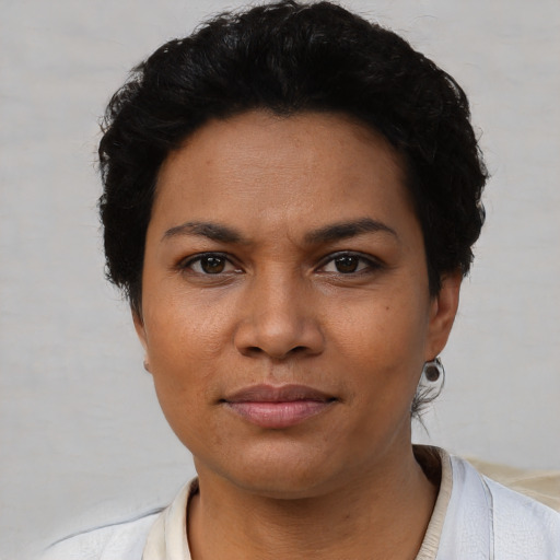 Neutral latino young-adult female with short  black hair and brown eyes