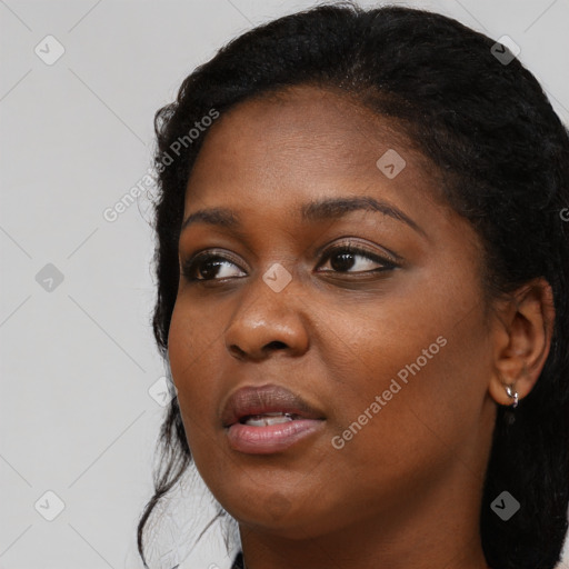 Joyful black young-adult female with medium  black hair and brown eyes