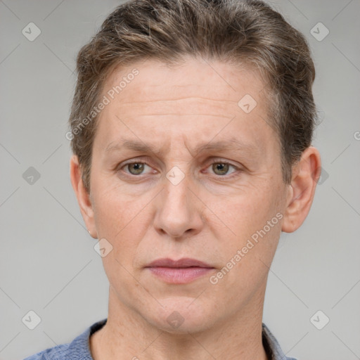 Joyful white adult male with short  brown hair and grey eyes