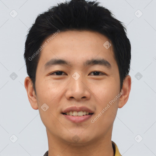 Joyful asian young-adult male with short  black hair and brown eyes