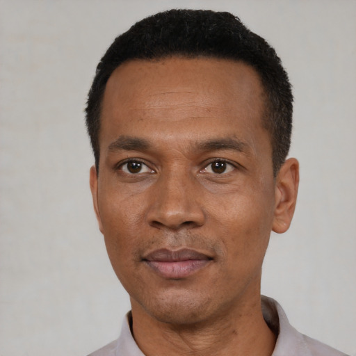 Neutral black adult male with short  black hair and brown eyes