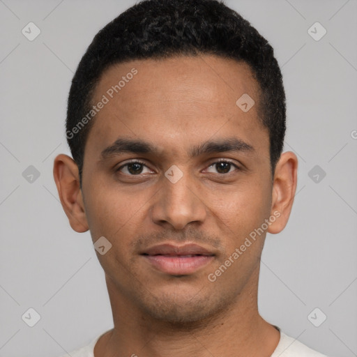 Joyful latino young-adult male with short  brown hair and brown eyes