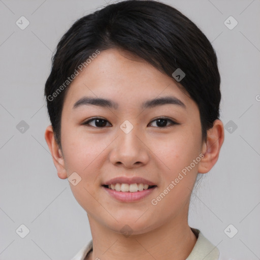 Joyful asian young-adult female with short  black hair and brown eyes
