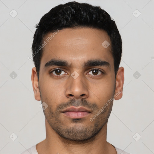 Neutral latino young-adult male with short  black hair and brown eyes