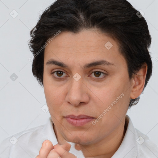 Joyful white adult female with short  brown hair and brown eyes