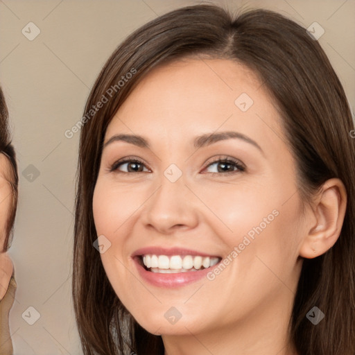 Joyful white young-adult female with long  brown hair and brown eyes