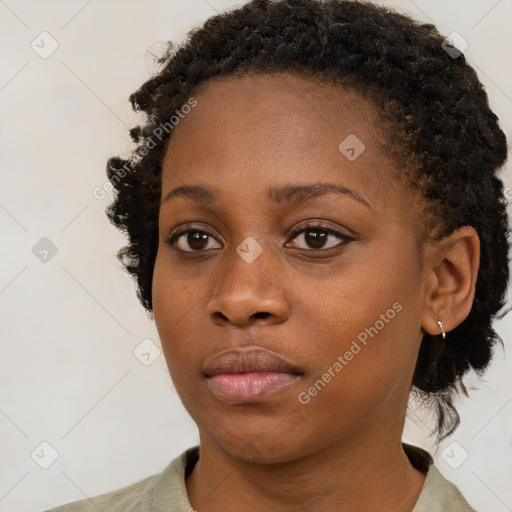 Neutral black young-adult female with medium  brown hair and brown eyes