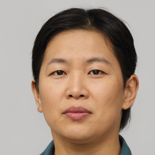 Neutral asian adult female with short  brown hair and brown eyes