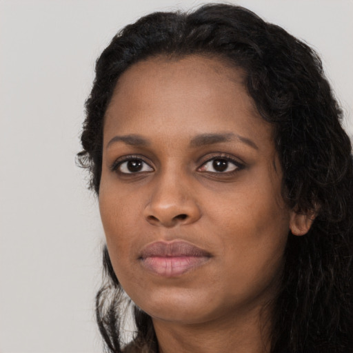 Neutral black young-adult female with long  black hair and brown eyes