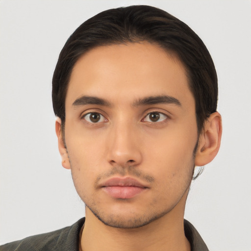 Neutral latino young-adult male with short  black hair and brown eyes