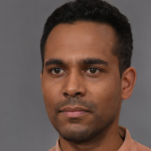 Neutral black young-adult male with short  black hair and brown eyes