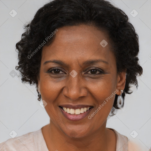 Joyful black adult female with short  brown hair and brown eyes