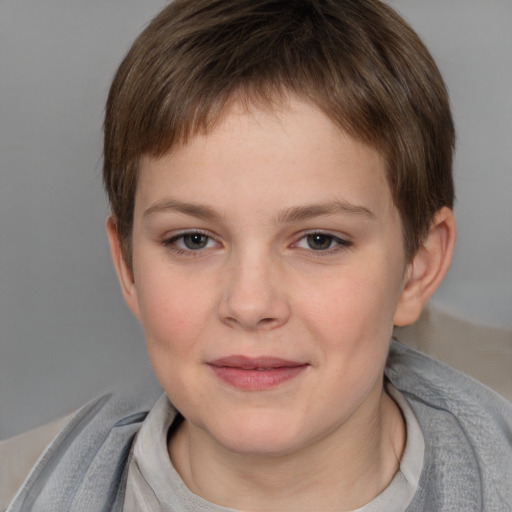 Joyful white child female with short  brown hair and grey eyes