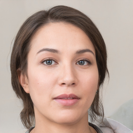 Neutral white young-adult female with medium  brown hair and brown eyes