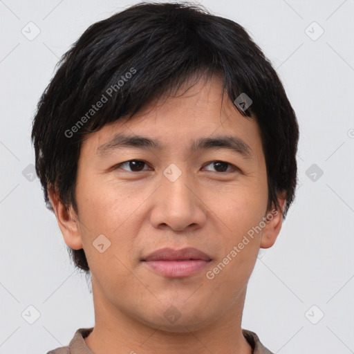 Joyful asian young-adult male with short  brown hair and brown eyes