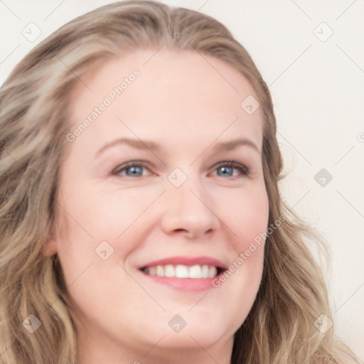 Joyful white young-adult female with long  brown hair and blue eyes