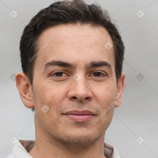 Joyful white adult male with short  brown hair and brown eyes