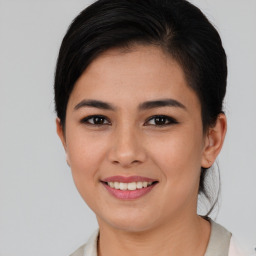 Joyful asian young-adult female with short  brown hair and brown eyes