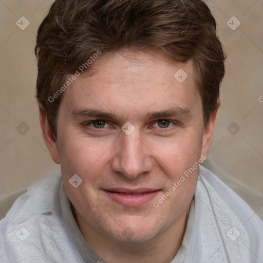 Joyful white adult male with short  brown hair and grey eyes