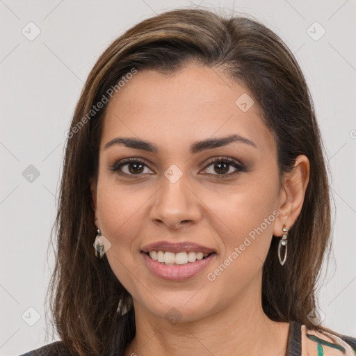 Joyful white young-adult female with long  brown hair and brown eyes