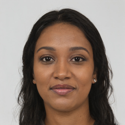 Joyful asian young-adult female with long  brown hair and brown eyes