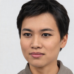 Joyful asian young-adult female with short  black hair and brown eyes