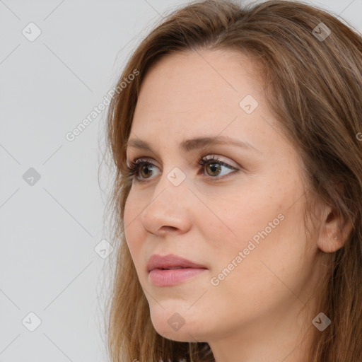 Neutral white young-adult female with long  brown hair and brown eyes