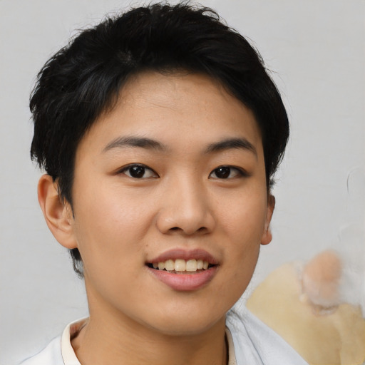 Joyful asian young-adult female with short  black hair and brown eyes