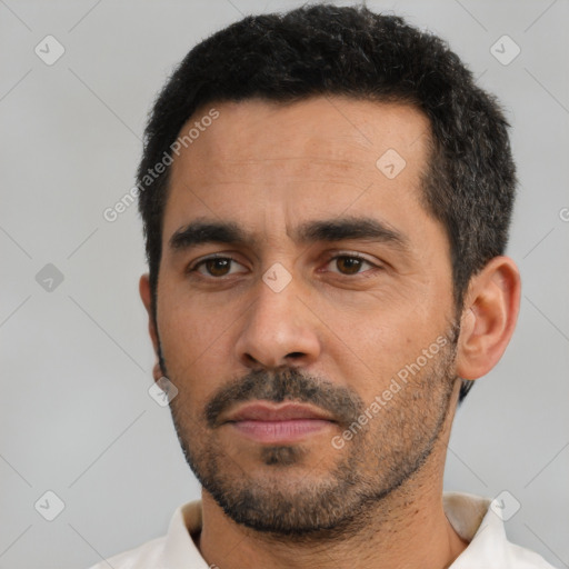 Neutral white young-adult male with short  black hair and brown eyes