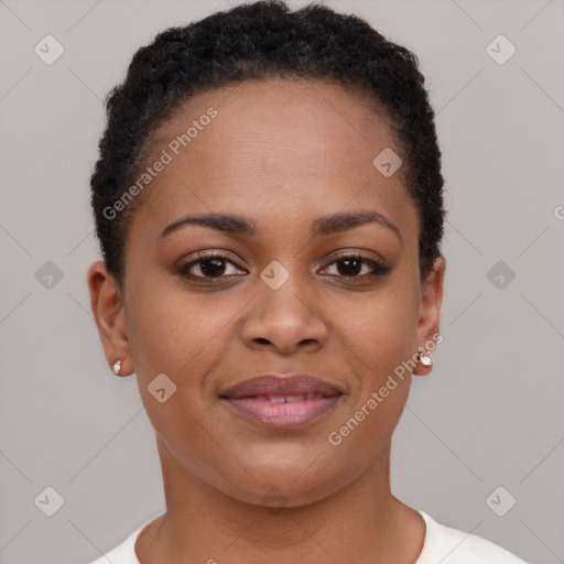 Joyful black young-adult female with short  brown hair and brown eyes