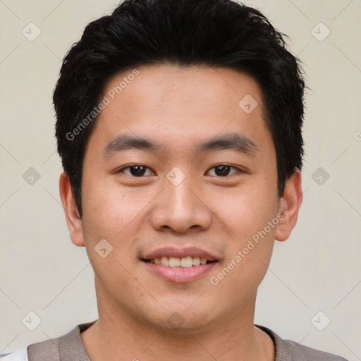 Joyful asian young-adult male with short  black hair and brown eyes