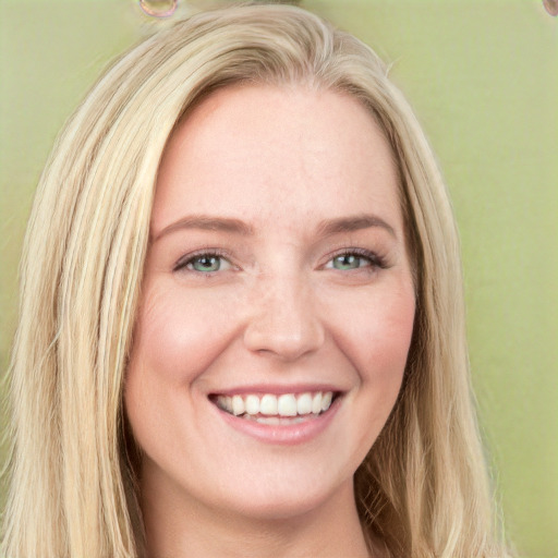 Joyful white young-adult female with long  brown hair and green eyes