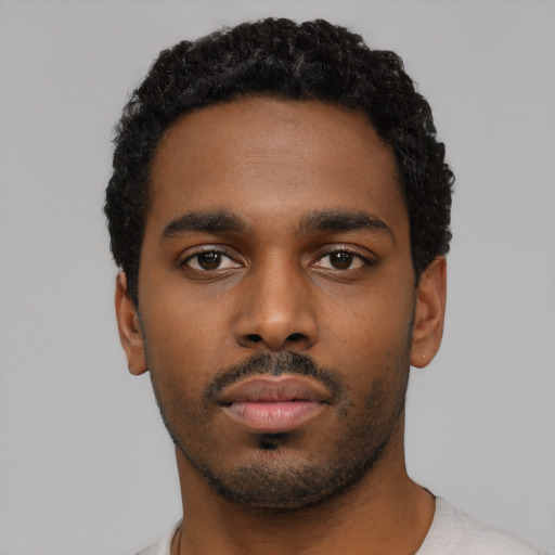 Neutral black young-adult male with short  black hair and brown eyes