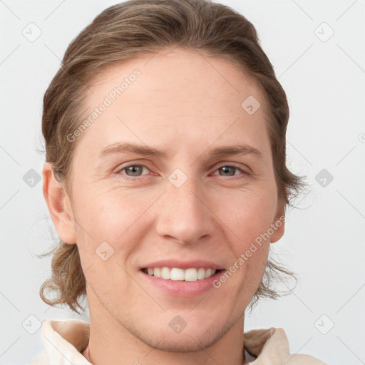 Joyful white young-adult female with short  brown hair and grey eyes