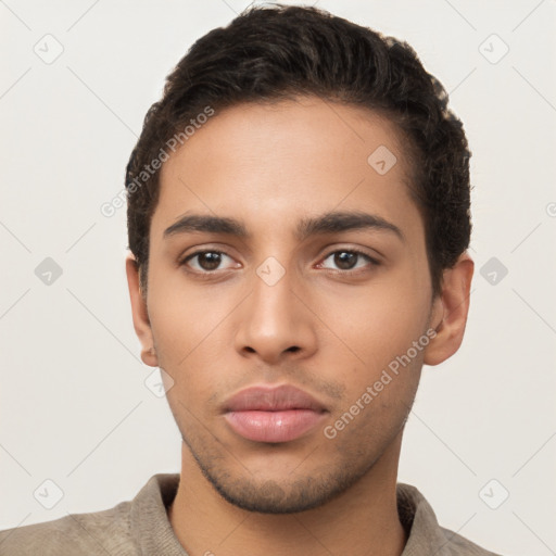 Neutral latino young-adult male with short  brown hair and brown eyes