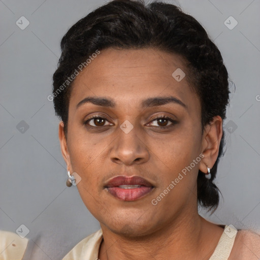 Joyful latino adult female with short  brown hair and brown eyes