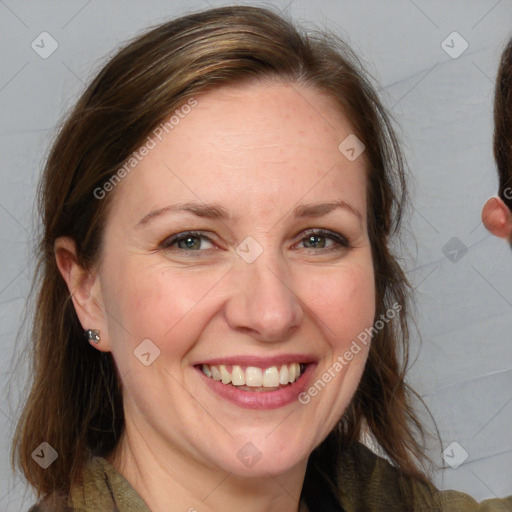 Joyful white adult female with medium  brown hair and grey eyes