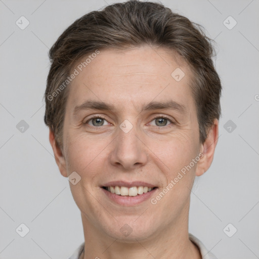 Joyful white adult male with short  brown hair and grey eyes