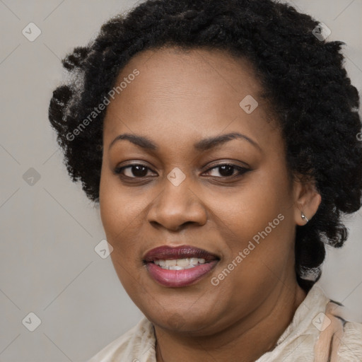 Joyful black adult female with short  brown hair and brown eyes