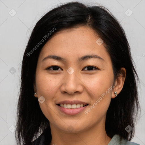 Joyful asian young-adult female with medium  brown hair and brown eyes