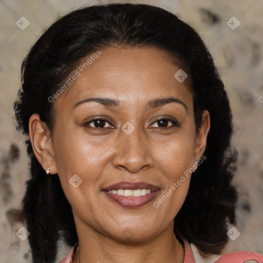 Joyful latino adult female with medium  brown hair and brown eyes