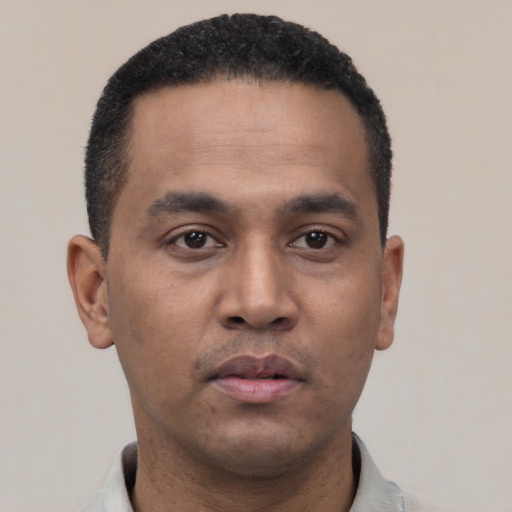 Neutral latino young-adult male with short  black hair and brown eyes