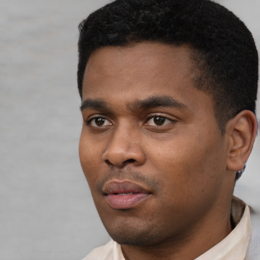 Neutral black young-adult male with short  black hair and brown eyes
