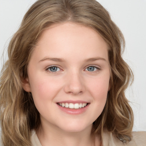 Joyful white young-adult female with medium  brown hair and green eyes