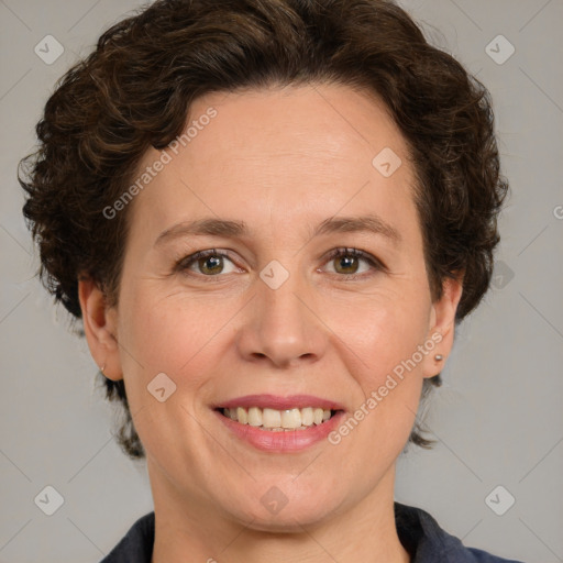 Joyful white adult female with medium  brown hair and green eyes