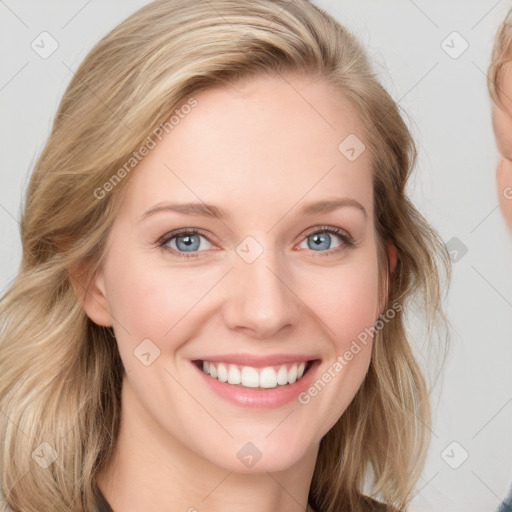 Joyful white young-adult female with medium  brown hair and blue eyes