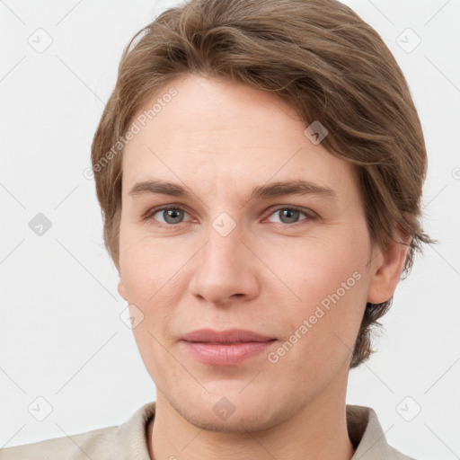 Joyful white young-adult female with short  brown hair and grey eyes